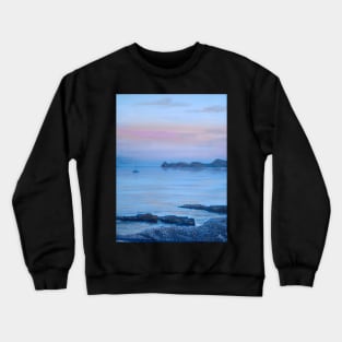 LOOKING TOWARDS PORTITXOL FROM CALA BLANCA BEACH AS THE SUN DISSAPEARS LEAVING A PURPLE BLUE SKY Crewneck Sweatshirt